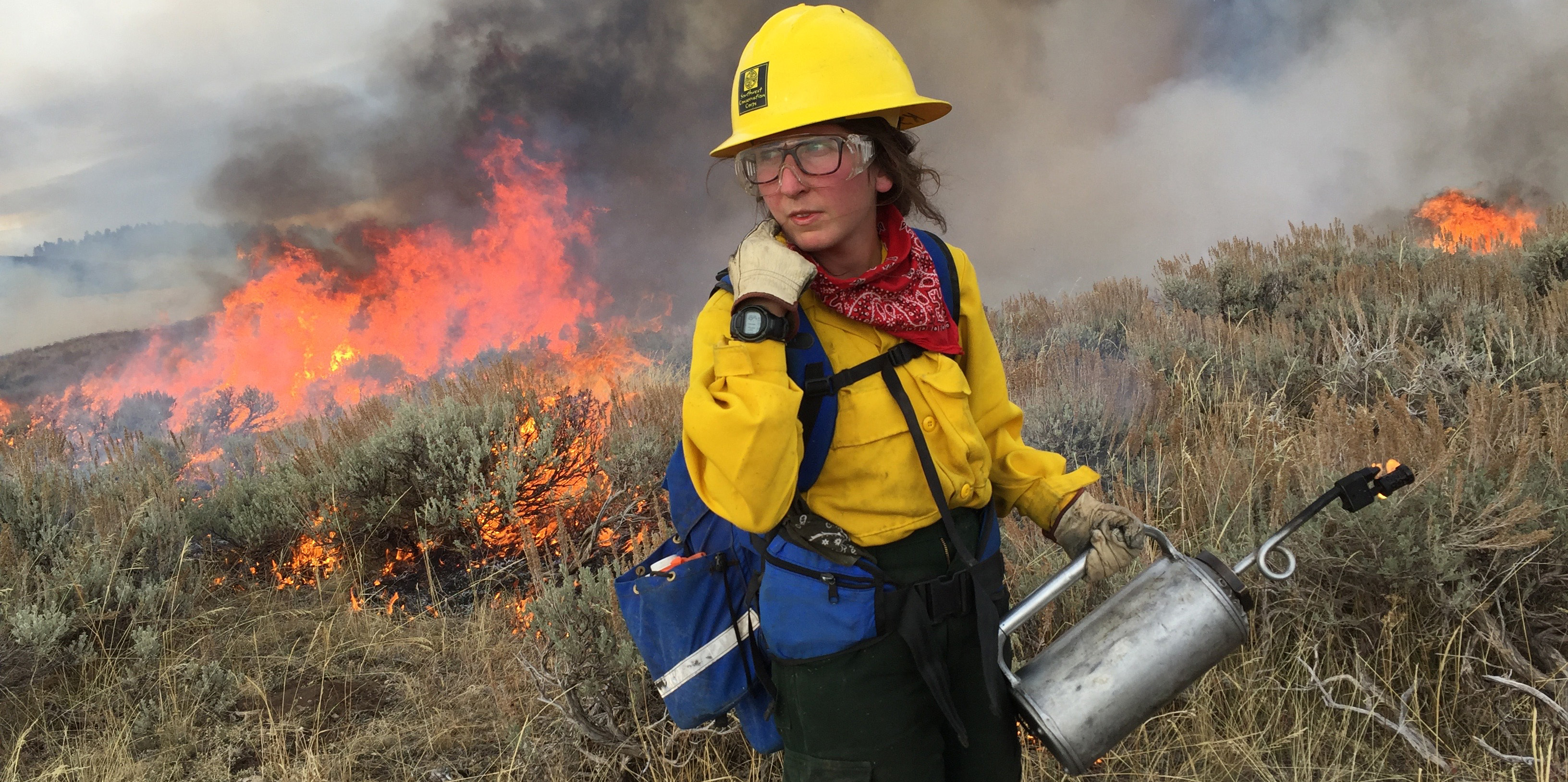 Women in Fire Corps Member with Driptorch